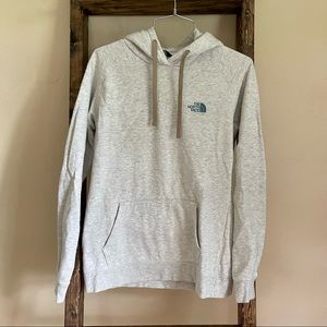 The North Face Hoodie - cream with graphics on back, size medium.